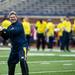 Blue Team quarterback BJ Dickey smiles and looks to pass during the alumni spring flag football game on Saturday, April 13. AnnArbor.com I Daniel Brenner